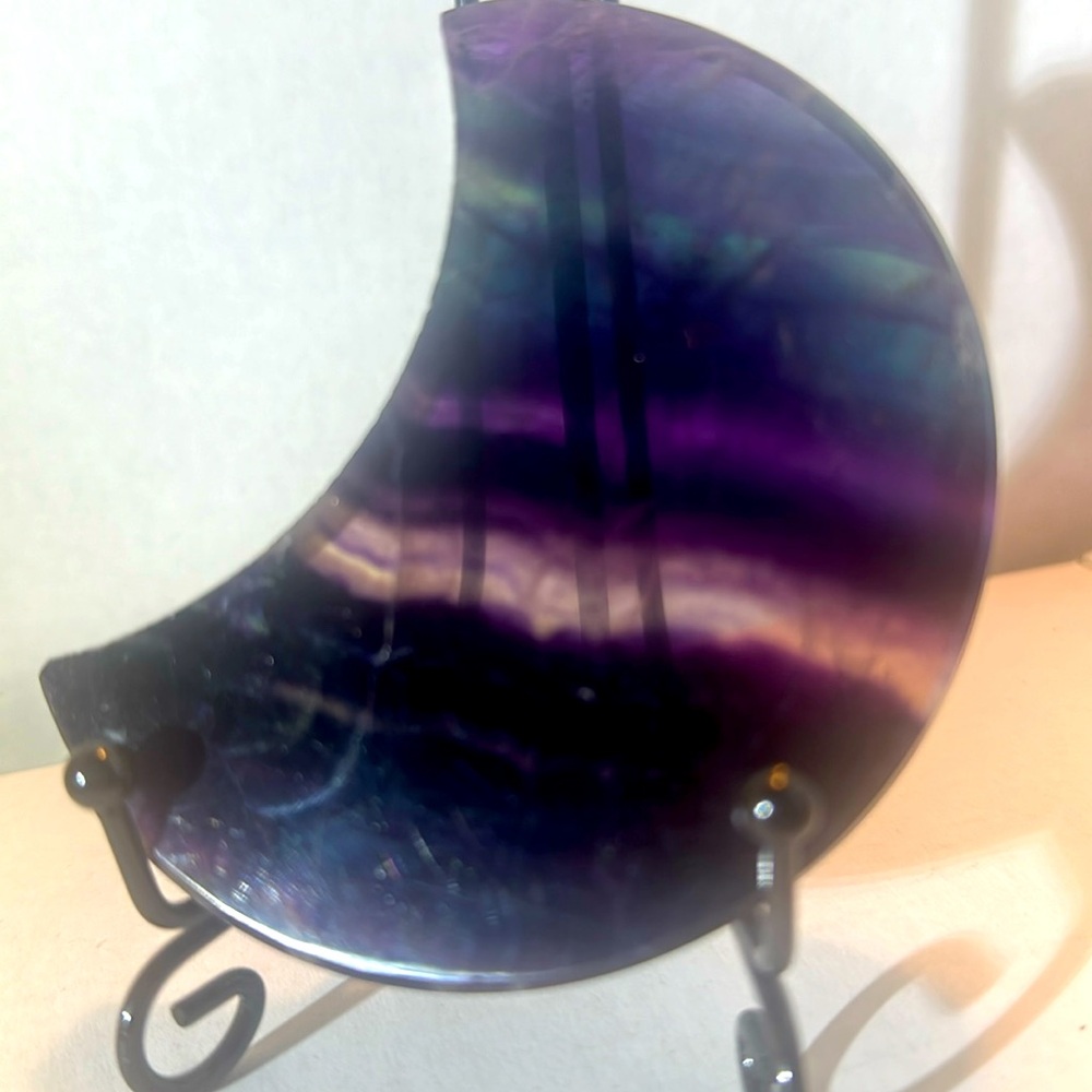 173g of purples and blue fluorite crescent moon shaped slice